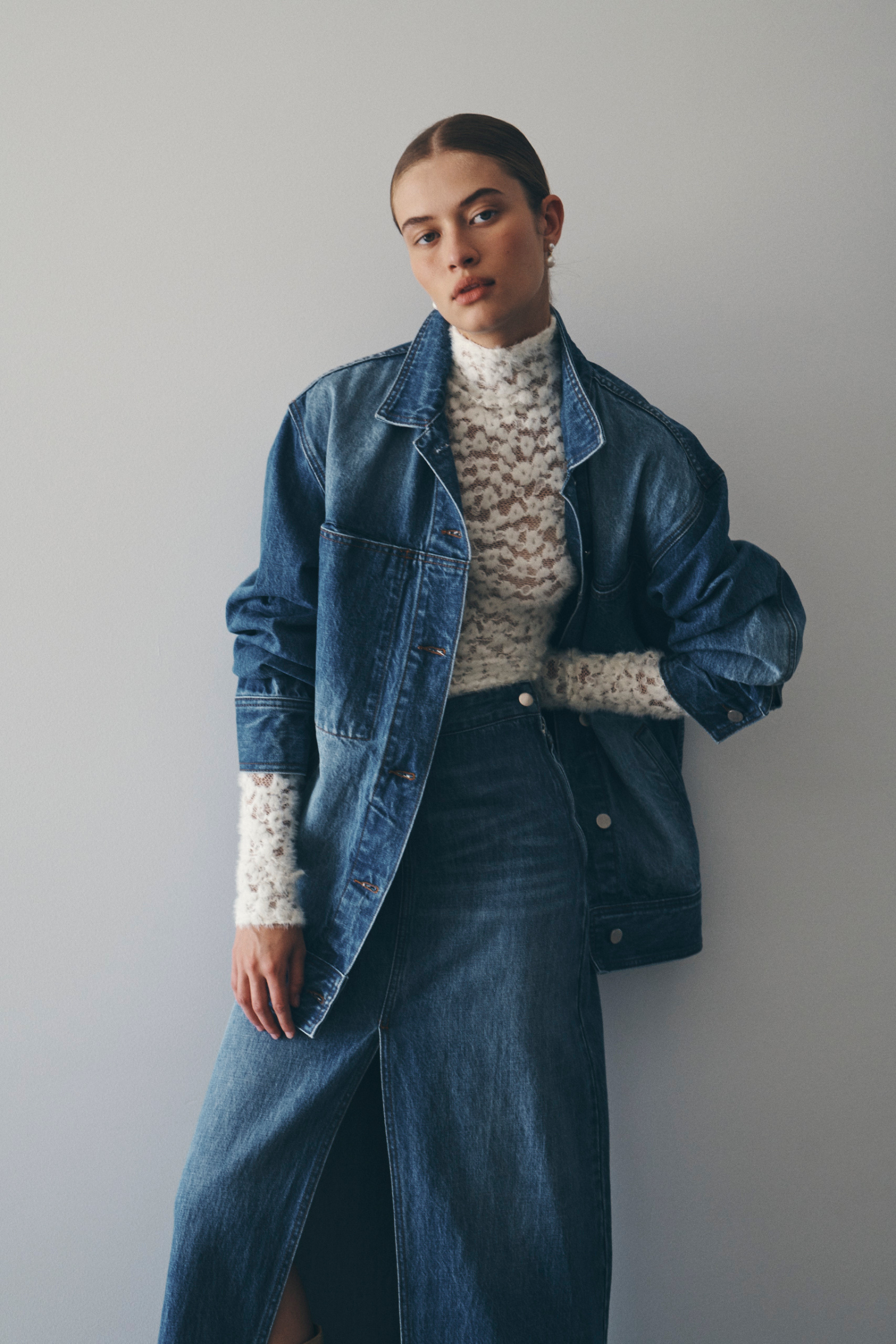Bianca wears the Iko Relaxed Denim Jacket, Valerie Hemp Midi Skirt, and Galo Lace Fuzzy Top in Creme. All pieces are from ROWIE The Label’s Autumn / Winter ’24 Collection. 